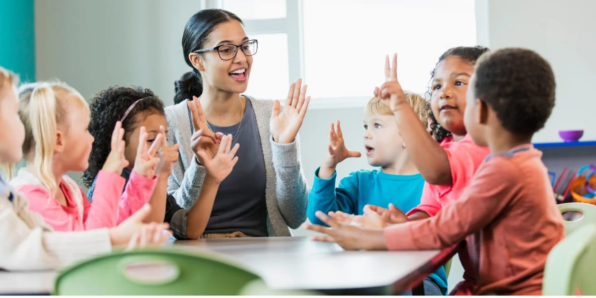 A teacher explaining English to students in a classroom